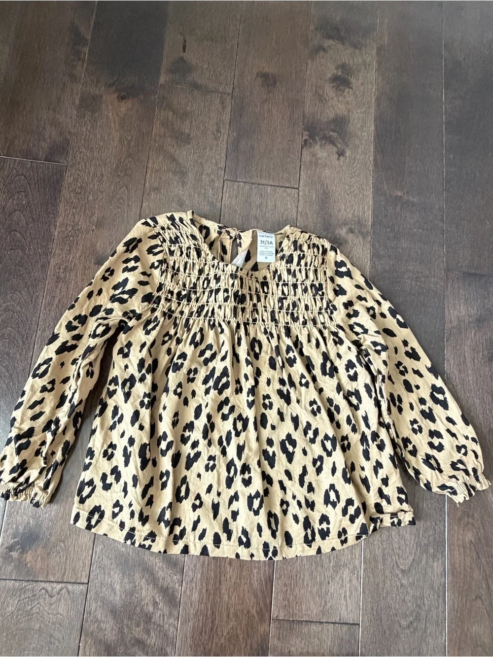 Toddler Girl Carter's Leopard Print Smocked Top with black leggings